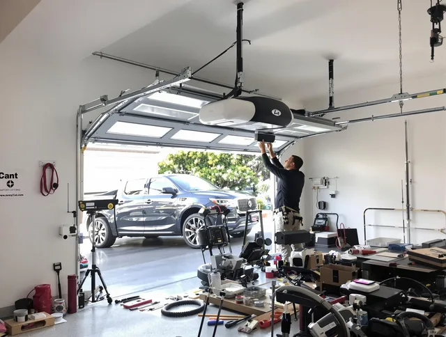 Hialeah Garage Door Repair specialist installing smart garage door opener system in Hialeah home